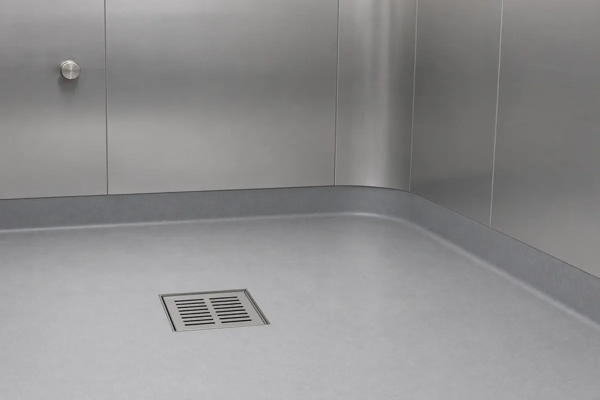 Example of an empty food-room floor with a square drain.